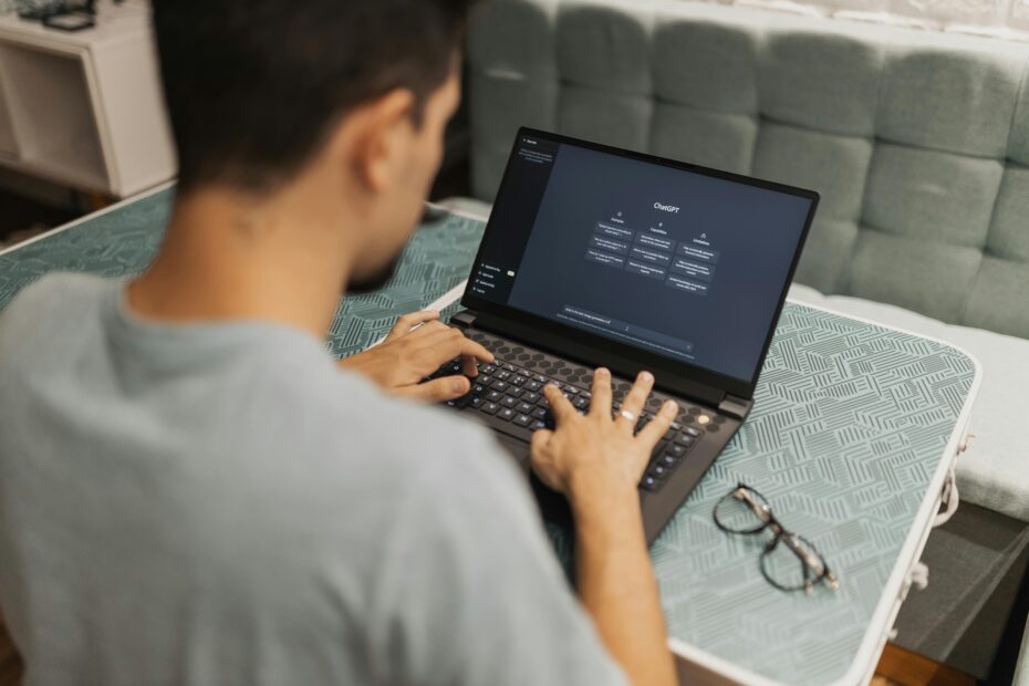 A man working on laptop with ChatGPT